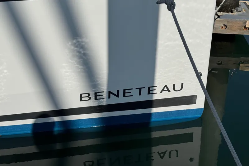 Slide: The Image of Beneteau Oceanis 35.1 sailboat, 2021 model, docked with visible branding. - 58