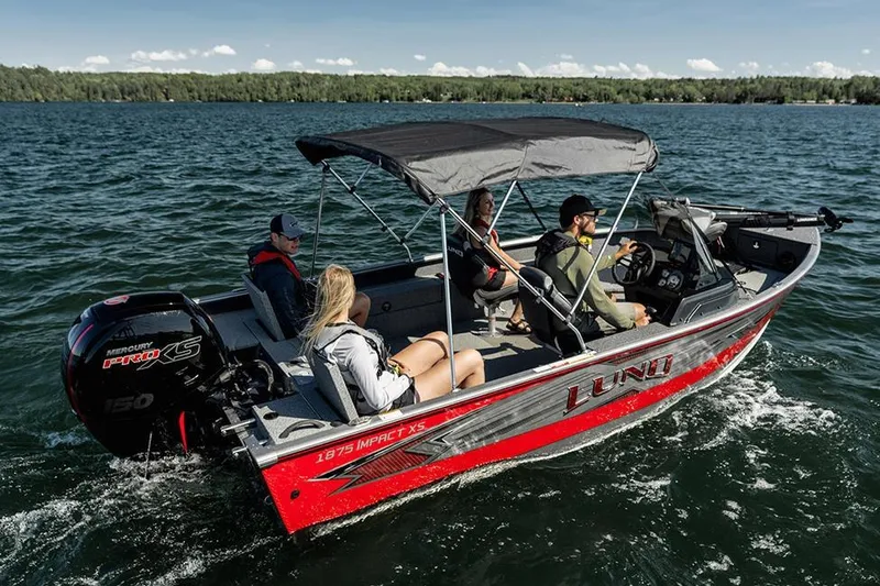 Slide: The Image of 2026 Lund 1875 Impact XS SS boat interior with seating and steering console. - 10