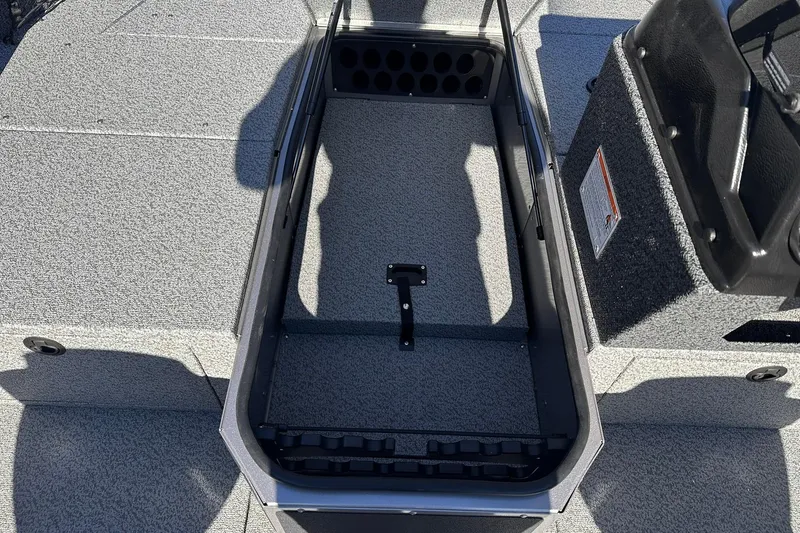 Slide: The Image of 2026 Lund 1875 Impact XS SS boat interior storage compartment, featuring durable design and ample space. - 16