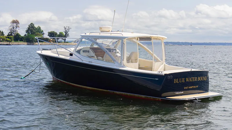 Slide: The Image of 2007 MJM 29z boat named Blue Water Bound on calm waters. - 1