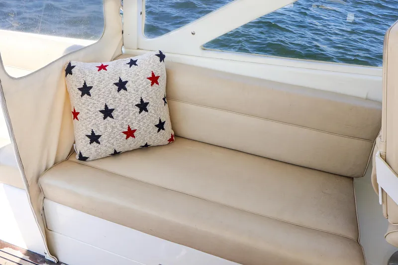 Slide: The Image of Beige seating with star-patterned pillow on 2007 MJM 29z boat. - 18