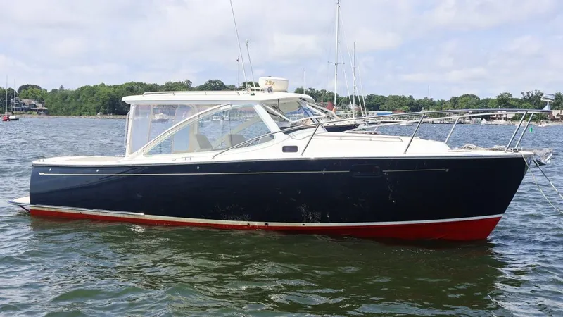 Slide: The Image of 2007 MJM 29z boat on calm water with scenic background. - 26