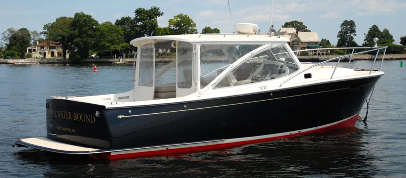 Slide: The Image of 2007 MJM 29z boat on calm water with scenic background. - 5