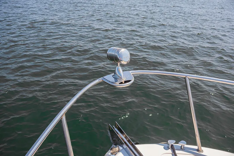 Slide: The Image of 2007 MJM 29z boat bow with chrome spotlight on water - 9