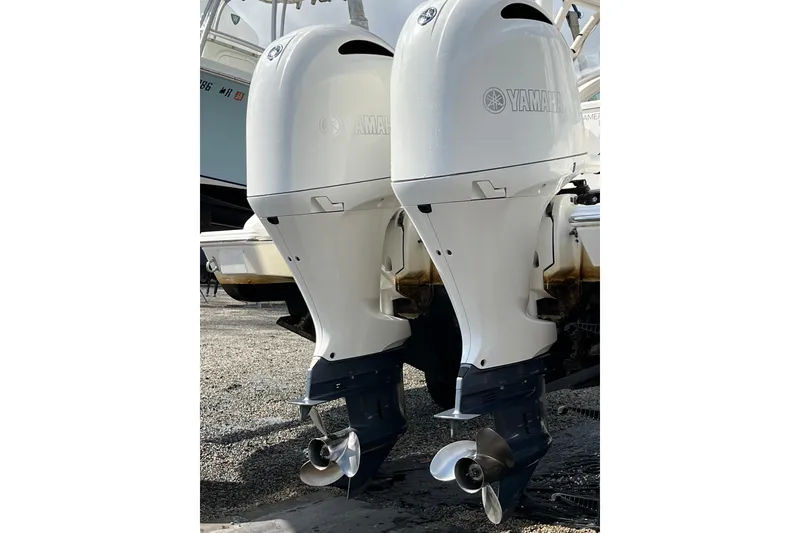 Slide: The Image of Twin Yamaha outboard engines on a 2020 Pursuit DC 266 Dual Console boat. - 23