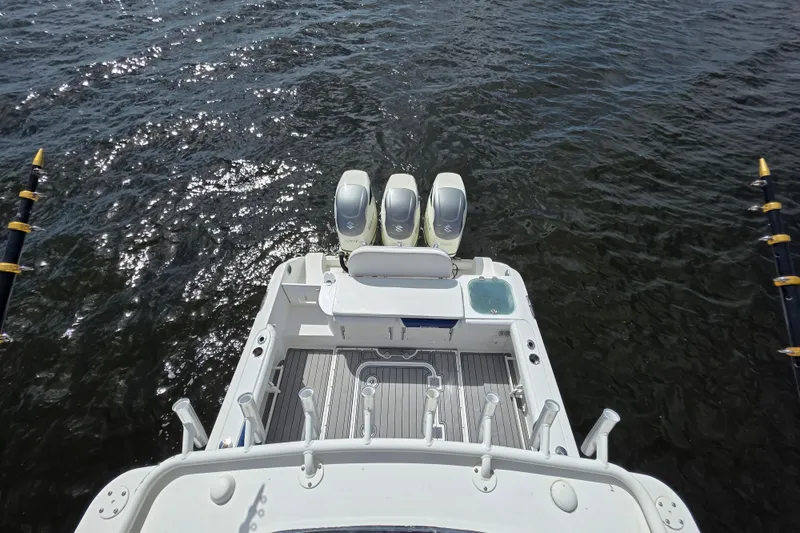 Slide: The Image of Aerial view of 2008 Everglades 350LX boat with triple engines on water. - 15