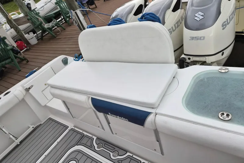 Slide: The Image of 2008 Everglades 350LX boat with Suzuki 350 engines, featuring a cushioned seating area. - 18