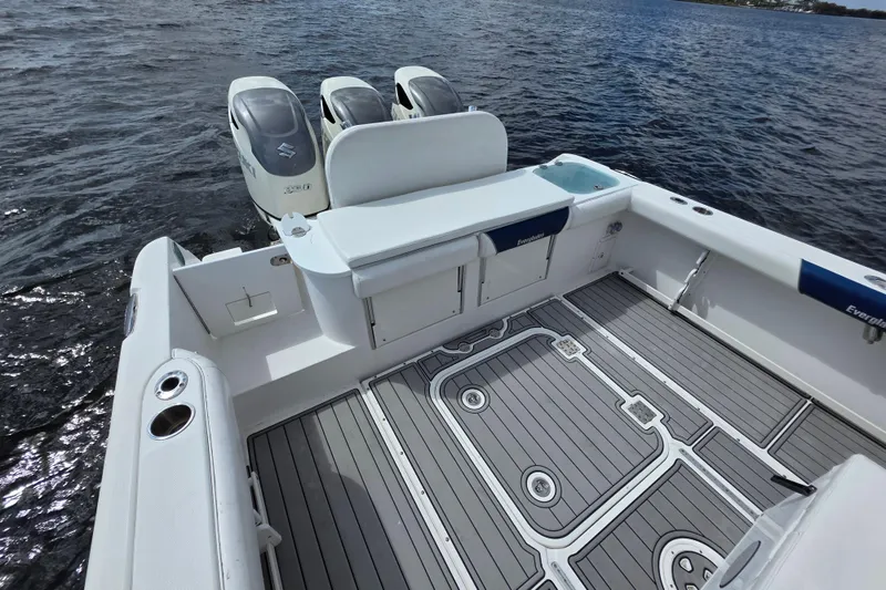 Slide: The Image of 2008 Everglades 350LX boat with triple engines on calm water. - 19