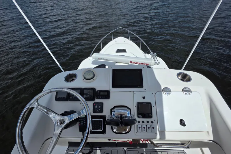 Slide: The Image of Cockpit view of 2008 Everglades 350LX boat with navigation equipment and steering wheel. - 23