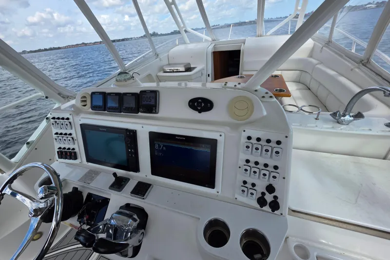 Slide: The Image of Cockpit of 2008 Everglades 350LX boat with navigation controls and seating area. - 9