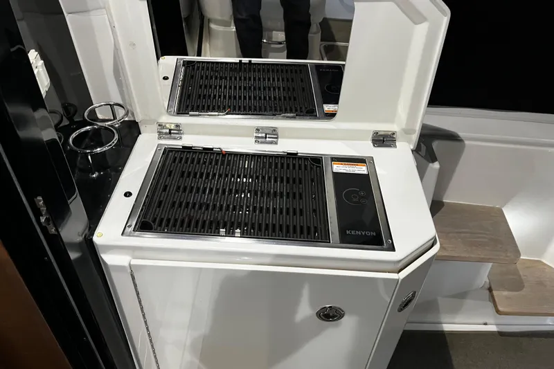 Slide: The Image of Luxurious interior of 2015 Sea Ray 510 Sundancer yacht with elegant seating and table. - 36