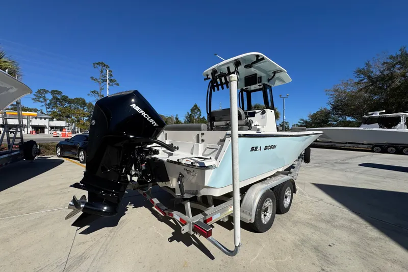 Slide: The Image of 2026 Sea Born LX22 Center Console boat on trailer with Mercury outboard engine. - 12
