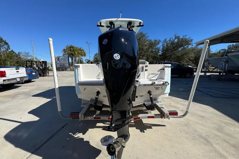 Slide: The Image of 2026 Sea Born LX22 Center Console boat on trailer, rear view with outboard motor. - 14
