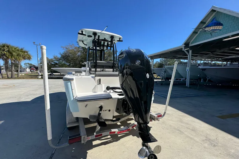 Slide: The Image of 2026 Sea Born LX22 Center Console boat with outboard motor on trailer. - 15