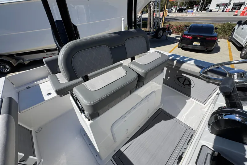 Slide: The Image of 2026 Sea Born LX22 Center Console boat interior with dual seats and steering wheel. - 35