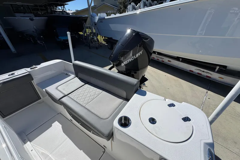 Slide: The Image of 2026 Sea Born LX22 Center Console boat with Mercury engine, featuring sleek seating and storage. - 38