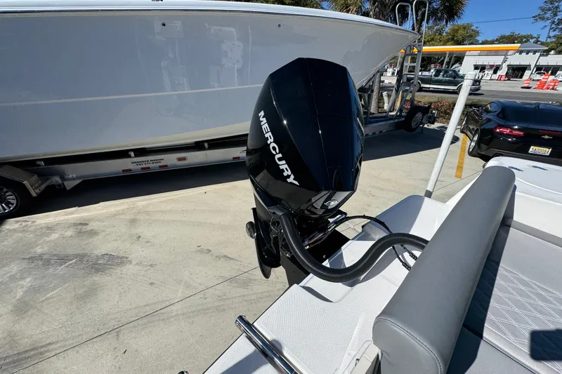 Slide: The Image of 2026 Sea Born LX22 Center Console with Mercury outboard engine, parked on a trailer. - 41