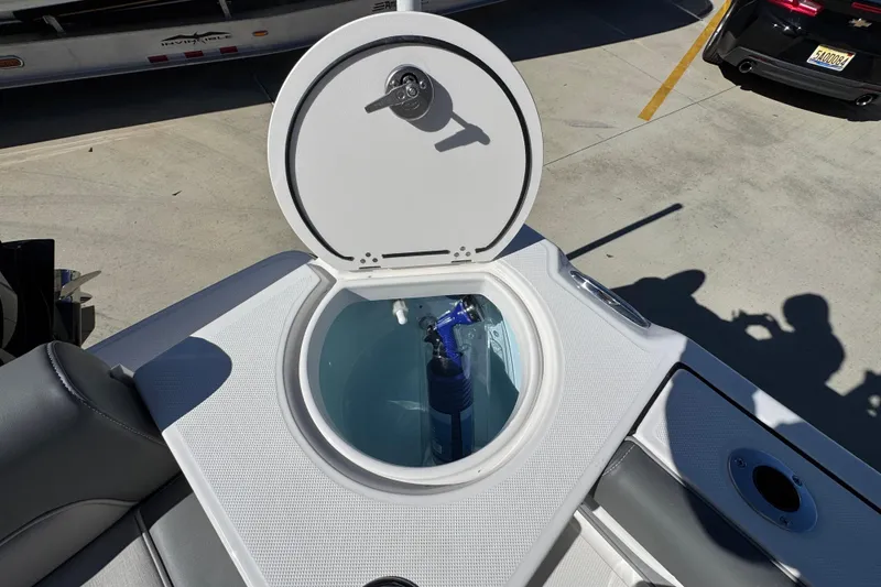 Slide: The Image of 2026 Sea Born LX22 Center Console boat with open storage compartment. - 42