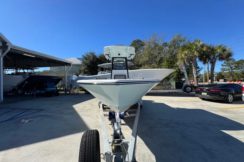 Slide: The Image of 2026 Sea Born LX22 Center Console boat on trailer in sunny outdoor setting. - 5