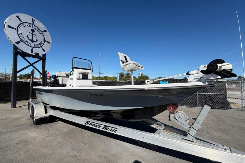 Slide: The Image of 2020 Blazer Bay 2200 Fisherman boat on trailer at dealership. - 1