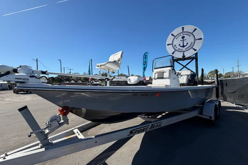 Slide: The Image of 2020 Blazer Bay 2200 Fisherman boat on trailer under clear blue sky. - 11