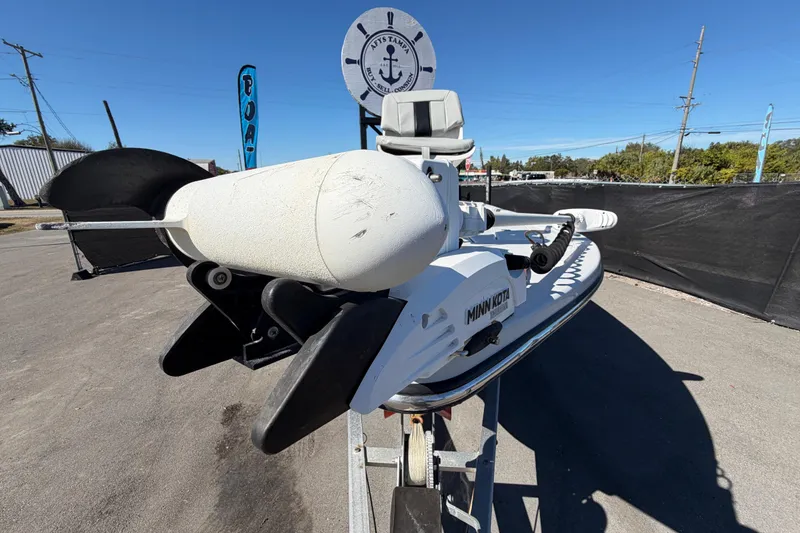 Slide: The Image of 2020 Blazer Bay 2200 Fisherman boat with Minn Kota motor, parked outdoors. - 13