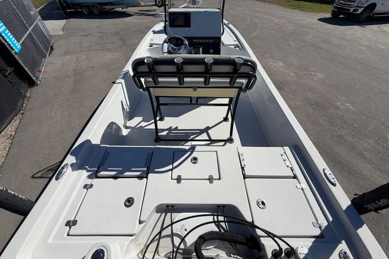 Slide: The Image of 2020 Blazer Bay 2200 Fisherman boat interior with seating and storage compartments. - 14