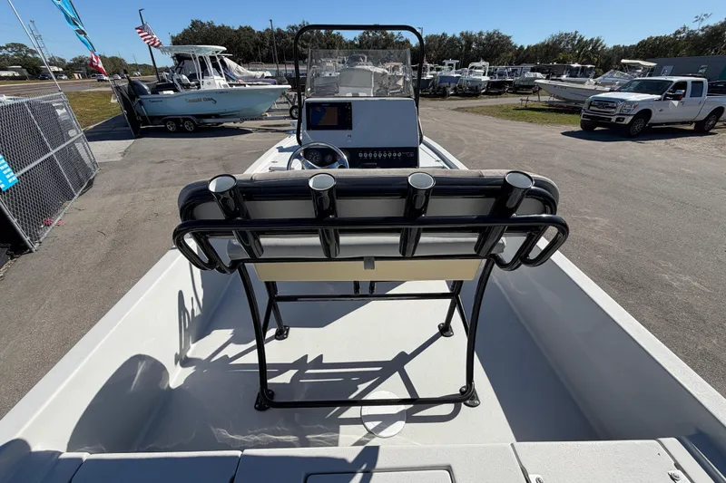 Slide: The Image of 2020 Blazer Bay 2200 Fisherman boat interior with steering console and rod holders. - 17