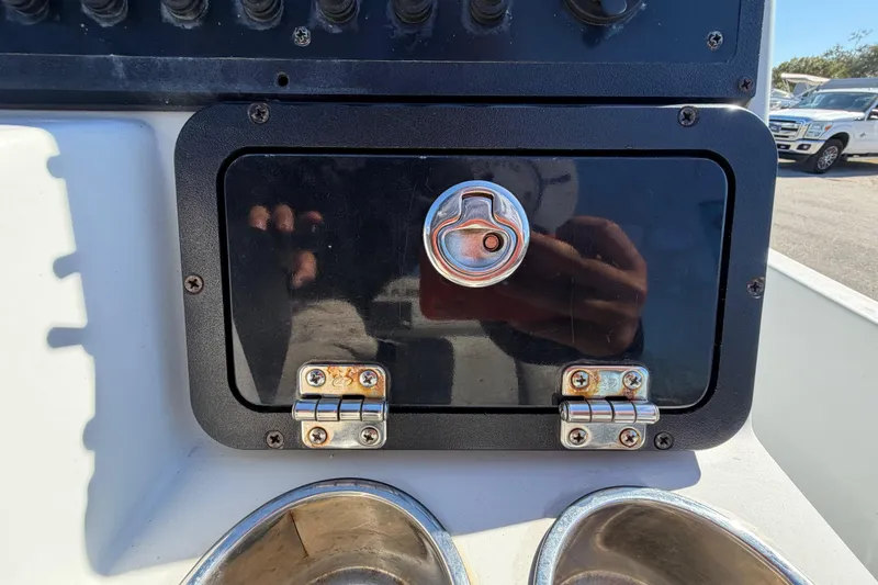 Slide: The Image of Control panel on 2020 Blazer Bay 2200 Fisherman boat with latch and cup holders. - 24