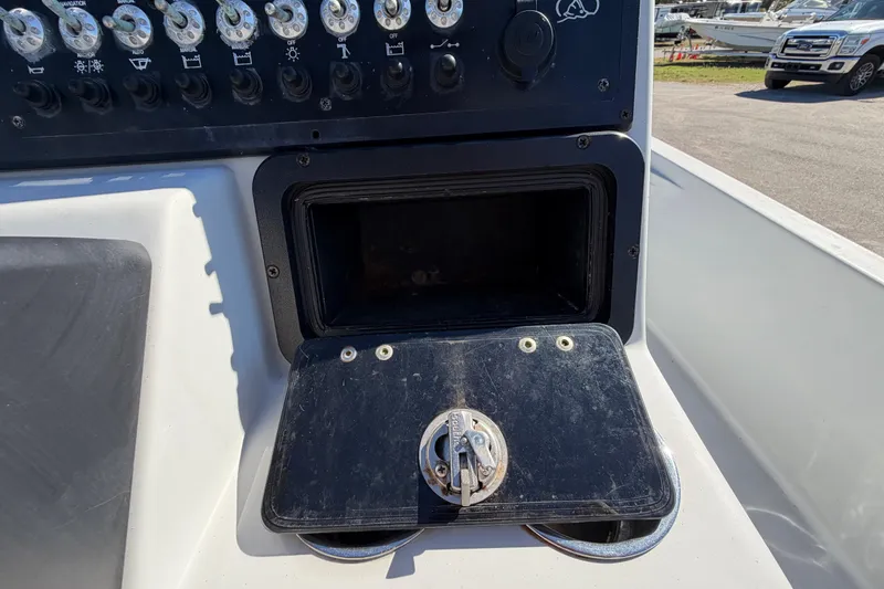 Slide: The Image of Control panel of 2020 Blazer Bay 2200 Fisherman boat with switches and storage compartment. - 25