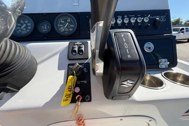 Slide: The Image of 2020 Blazer Bay 2200 Fisherman boat dashboard with controls and gauges. - 27