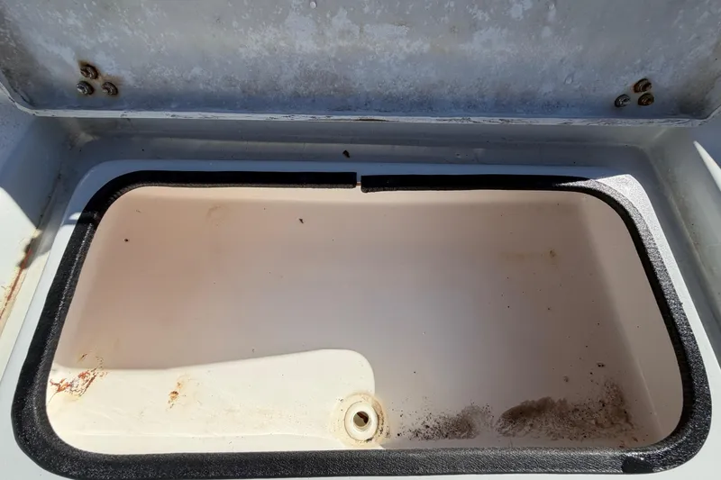 Slide: The Image of 2020 Blazer Bay 2200 Fisherman boat storage compartment, open and empty. - 35