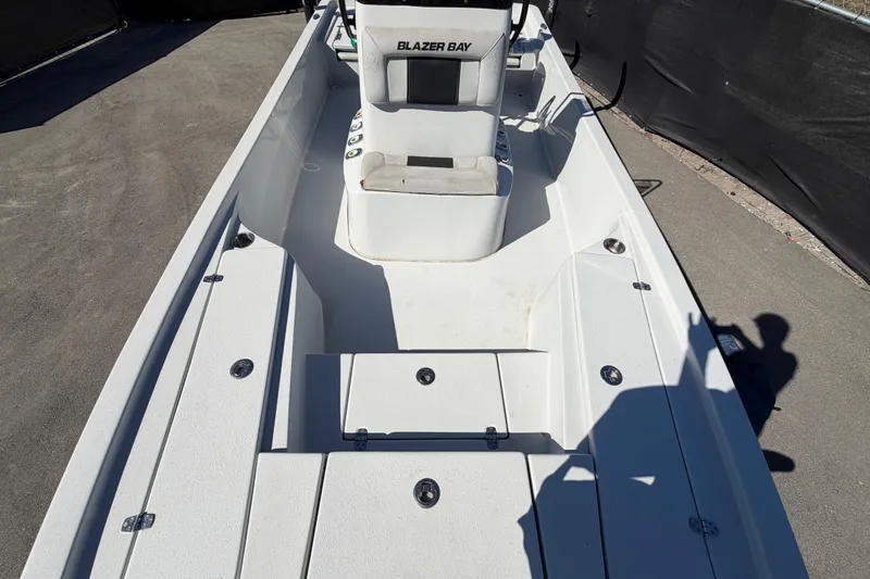 Slide: The Image of 2020 Blazer Bay 2200 Fisherman boat interior with seating and storage compartments. - 50