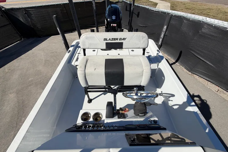 Slide: The Image of 2020 Blazer Bay 2200 Fisherman boat interior with steering wheel and seating. - 56