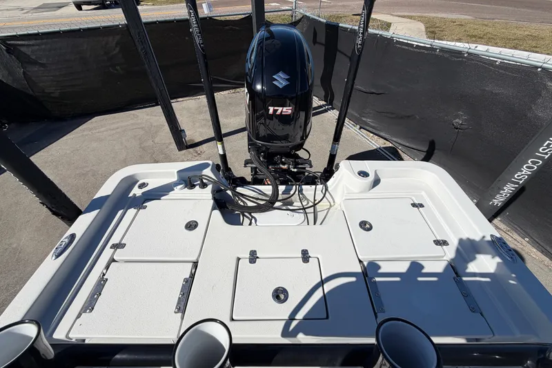 Slide: The Image of 2020 Blazer Bay 2200 Fisherman boat with Suzuki 175 engine, docked outdoors. - 58