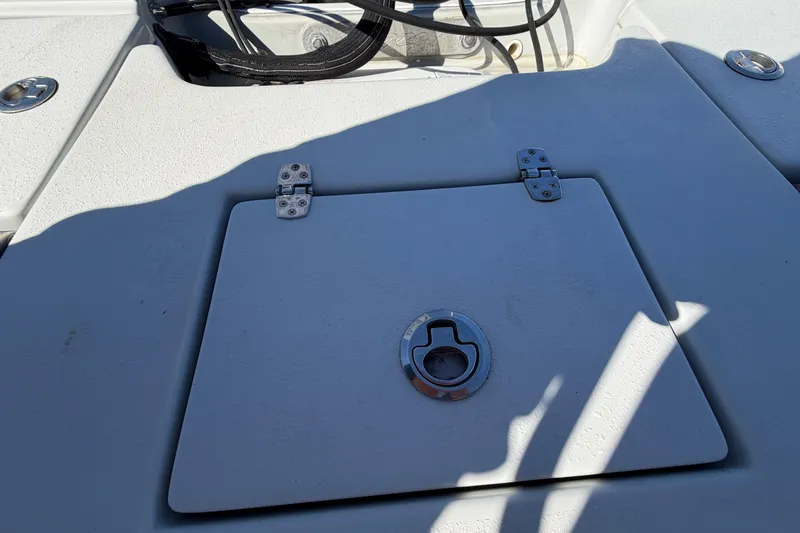 Slide: The Image of 2020 Blazer Bay 2200 Fisherman boat deck with storage hatch and latch. - 62