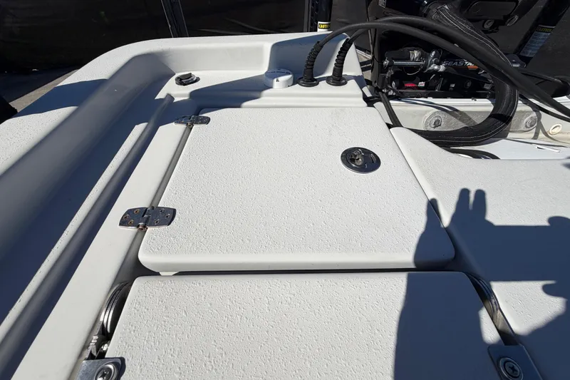 Slide: The Image of 2020 Blazer Bay 2200 Fisherman boat deck with storage compartments and control cables. - 70