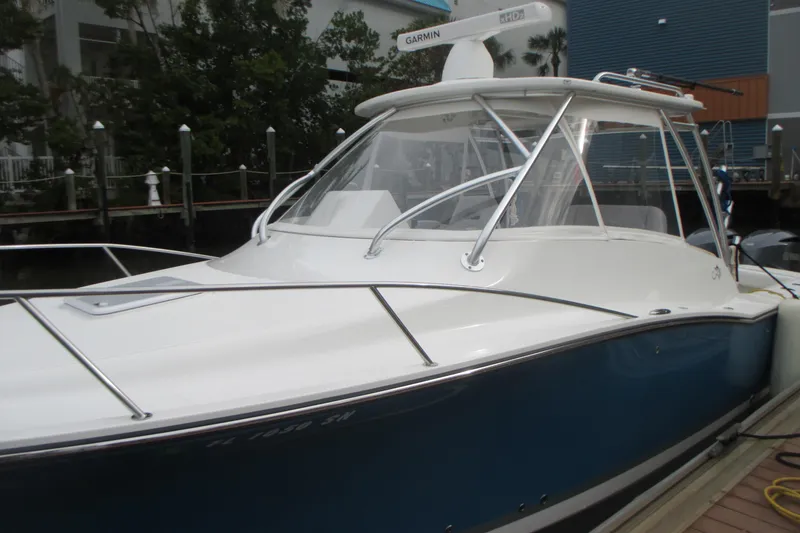 Slide: The Image of 2020 Albemarle 290 Express Fisherman boat docked, featuring sleek design and modern equipment. - 1