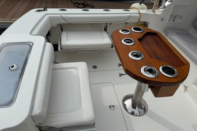 Slide: The Image of 2020 Albemarle 290 Express Fisherman boat interior with seating and rod holders. - 11