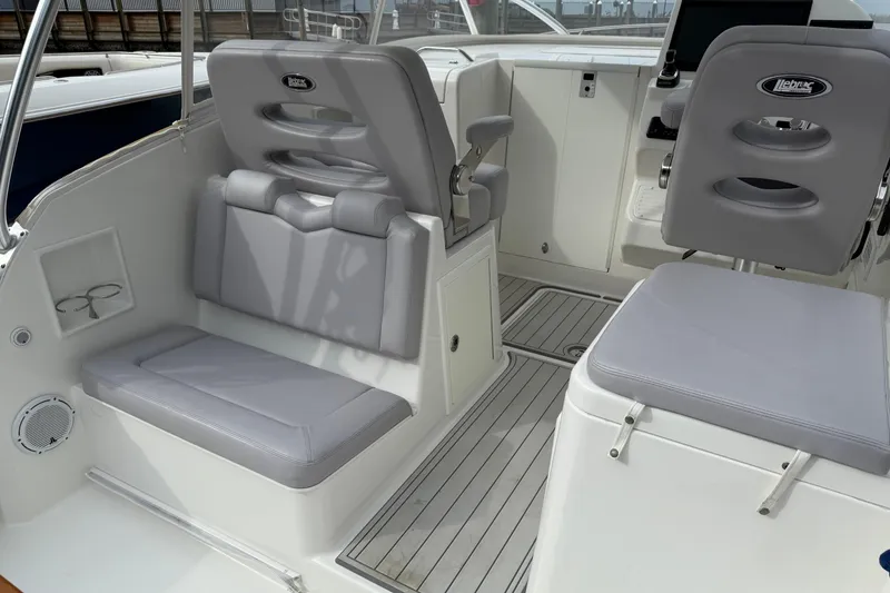 Slide: The Image of 2020 Albemarle 290 Express Fisherman boat interior with gray seating and modern design. - 17