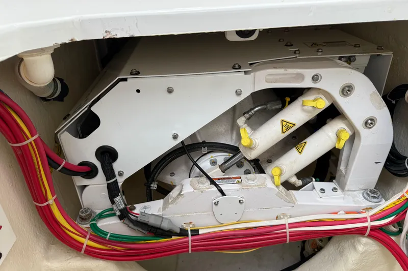 Slide: The Image of Engine compartment of 2020 Albemarle 290 Express Fisherman with hydraulic components and wiring. - 28