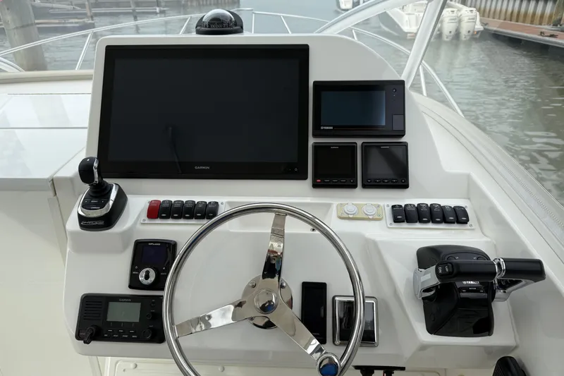 Slide: The Image of Helm of 2020 Albemarle 290 Express Fisherman with advanced navigation and control systems. - 30