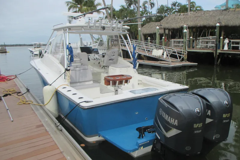 Slide: The Image of 2020 Albemarle 290 Express Fisherman boat docked with twin Yamaha V8 engines. - 4