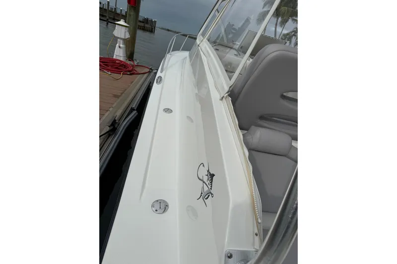 Slide: The Image of 2020 Albemarle 290 Express Fisherman boat docked, showcasing sleek design and comfortable seating. - 8