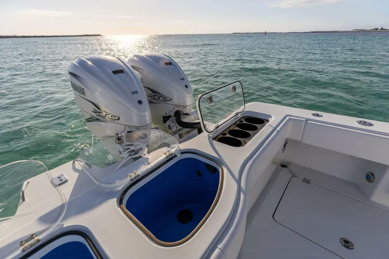 Slide: The Image of 2024 Freeman 47 boat with Yamaha engines on open water. - 14