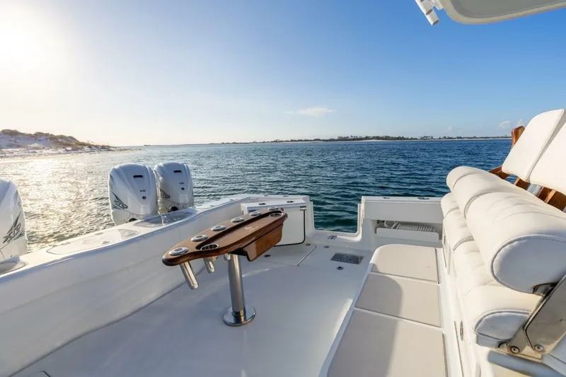 Slide: The Image of Luxurious 2024 Freeman 47 boat with dual engines, spacious seating, and ocean view. - 15