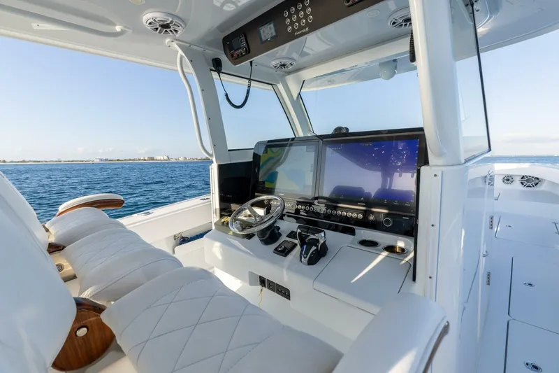 Slide: The Image of Luxurious 2024 Freeman 47 yacht cockpit with advanced navigation systems and plush seating. - 18