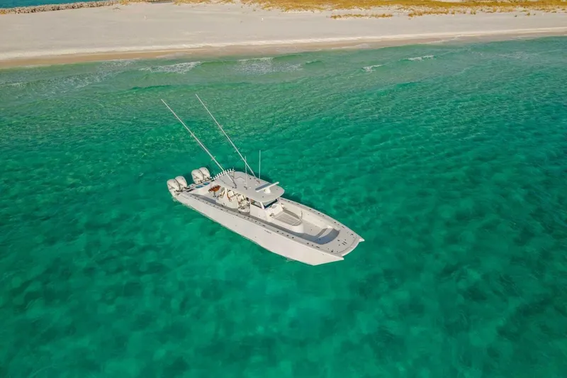 Slide: The Image of Aerial view of 2024 Freeman 47 boat on clear turquoise water near sandy beach. - 35