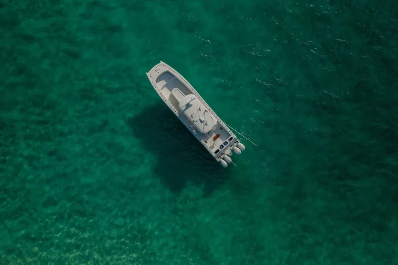 Slide: The Image of Aerial view of 2024 Freeman 47 boat on clear turquoise water. - 37