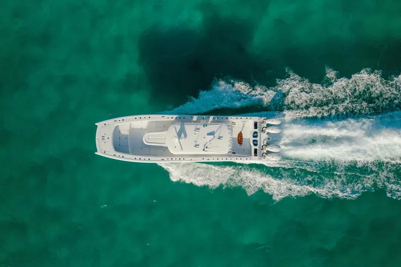 Slide: The Image of Aerial view of 2024 Freeman 47 boat cruising on turquoise water. - 40